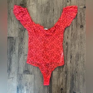 Free People pink lace one piece. Size small.